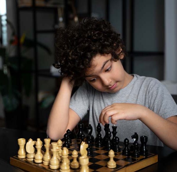 young-kid-playing-chess
