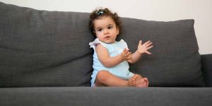 At what Age do Babies typically begin Clapping and Pointing
