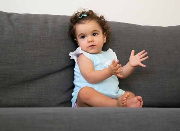 At what Age do Babies typically begin Clapping and Pointing