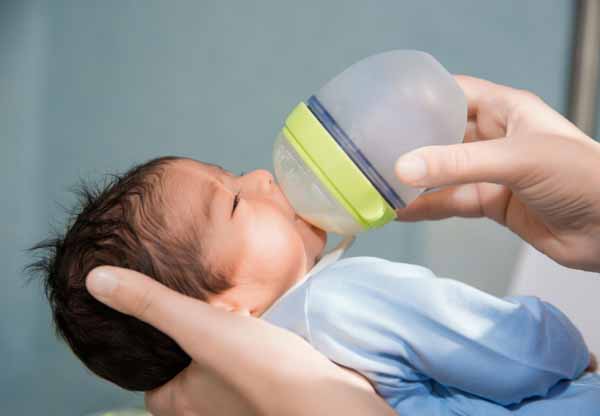 Baby Spitting Up Curdled Milk: Causes, Solutions & When to Worry