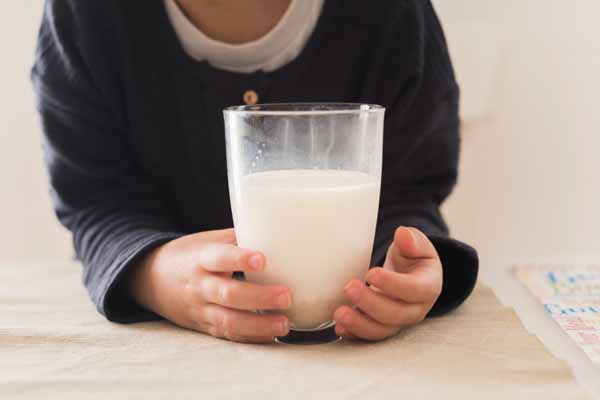 Baby Spitting Up Curdled Milk: Causes, Solutions & When to Worry